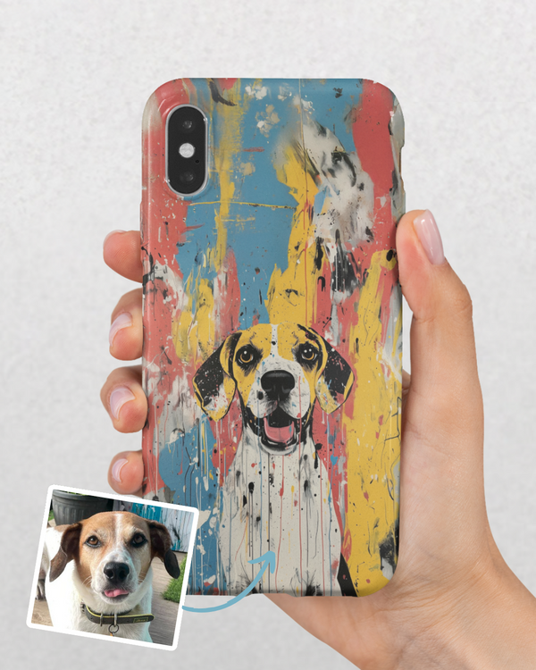 A hand holds an iPhone with the Custom Pet iPhone Case – Abstract Art, featuring a vibrant painted dog inspired by the real pet in an inset photo. The design pops with bold blue, yellow, red, and black brush strokes.
